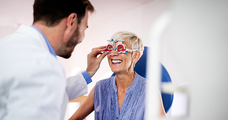 opthamologist testing patients eyes